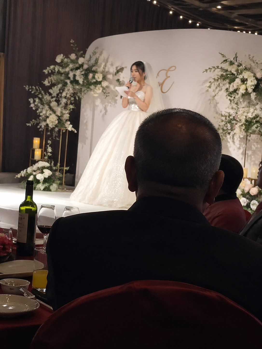Father Watches the Bride Speak at Her Wedding