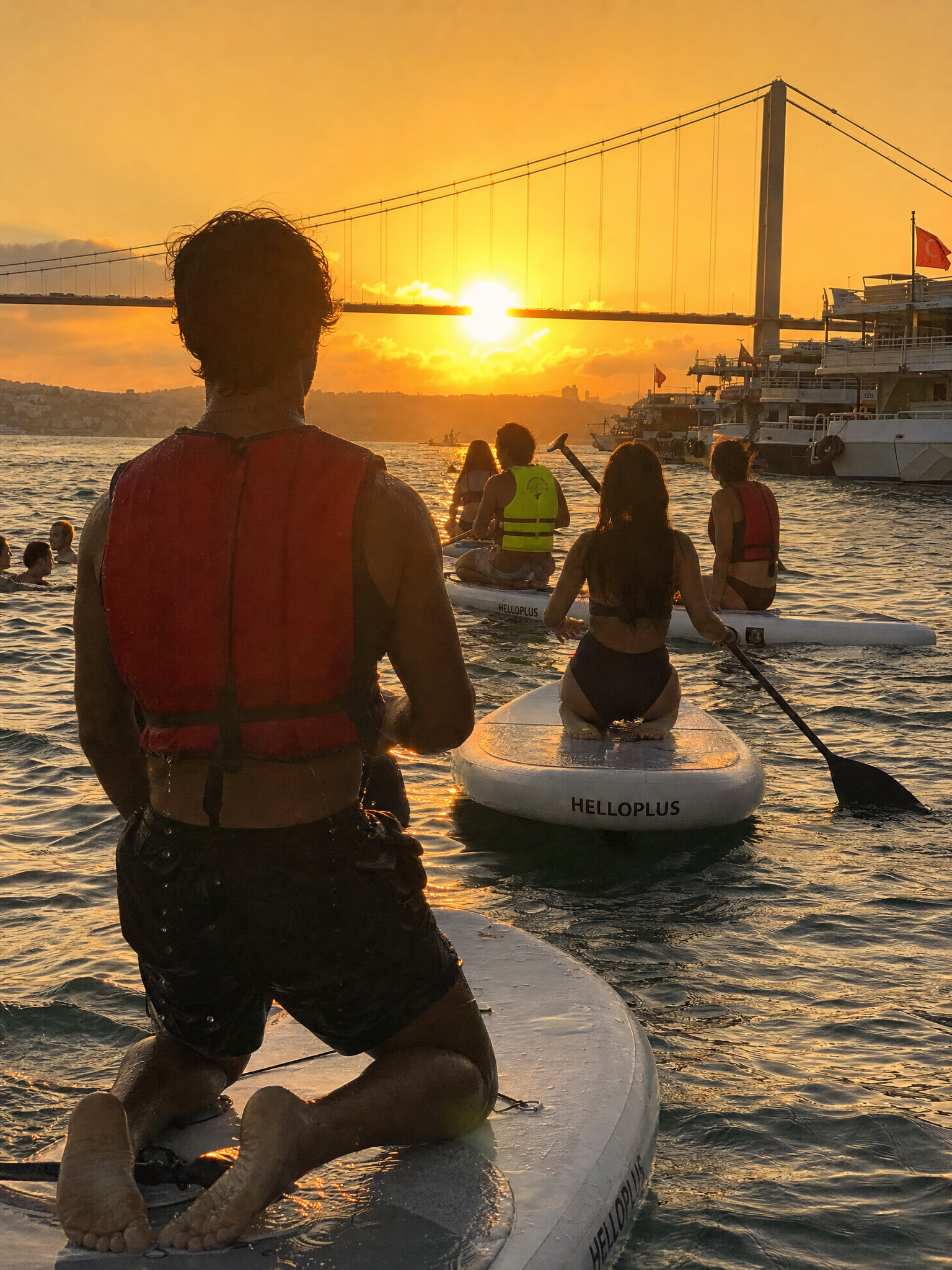 Paddleboarding Beneath a Blazing Sunset Bridge