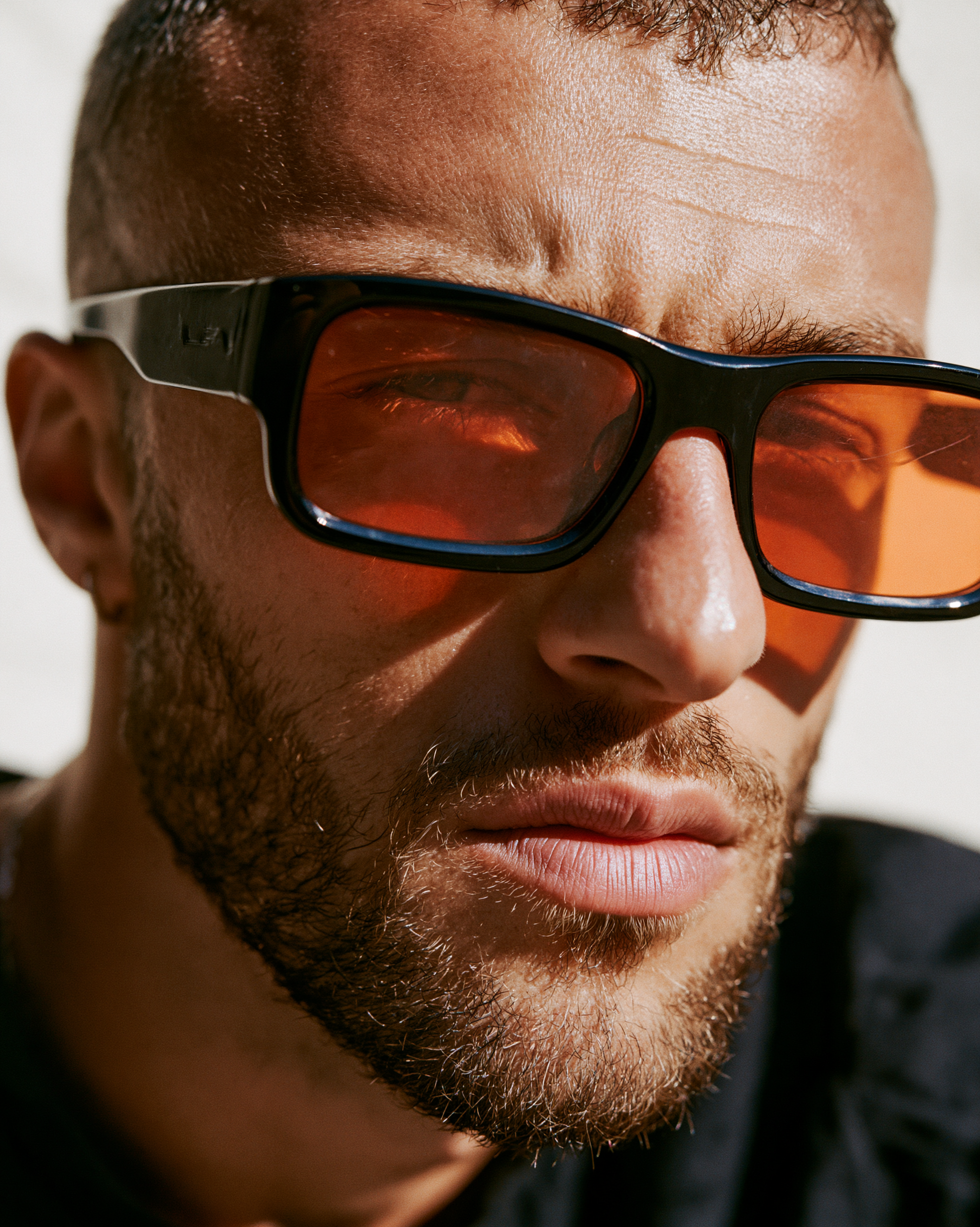 Male Model in Orange-Lens Sunglasses